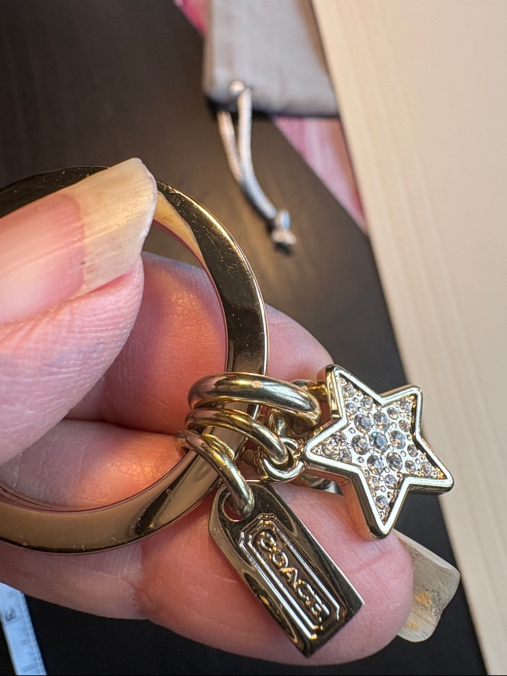 Coach Gold-Tone Star Cutout Keychain with Crystal Accents - Picture 4 of 5